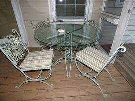 Unique iron outdoor table and chair set