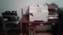 printer/scanner/fax, wooden table, radio, office supplies