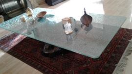 gorgeous glass-top table with wooden tree stump base, tabletop knickknacks