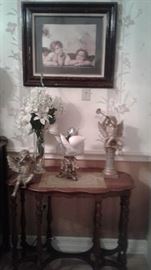 wall decor, angel figurines, wooden table 