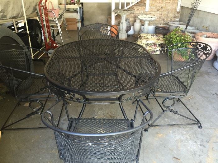 #29 Wrought Iron oval Table with 4 chairs $150 — in Meridianville, Alabama.
