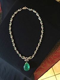 Custom emerald necklace with 37.06 ct. center stone.  Appraisal included