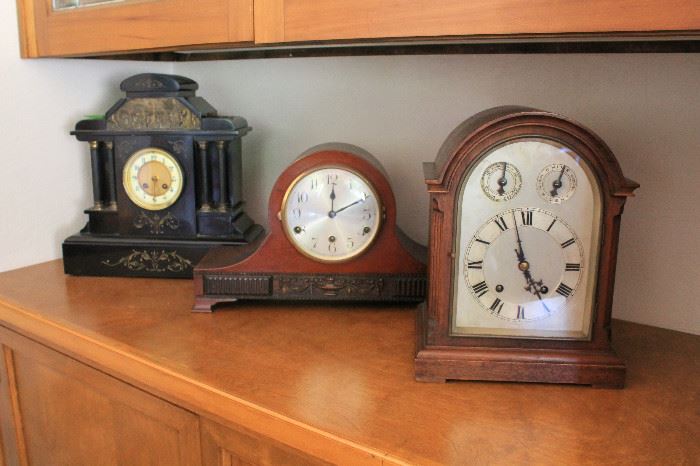 From left to right - French, English and German mantle clocks