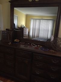 dresser, few pieces of costume jewelry