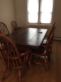 large solid wood dining table and 6 chairs