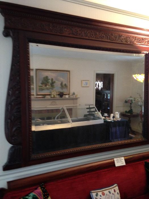 Massive antique mirror with beautiful carved frame.