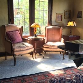 Wing Chairs; Chess-Top Occasional Table; 
Reproduction Table Lamp bearing the mark Galle; Slag Glass Table Lamp; Detail of 9 X 12 Arts & Crafts Style Rug