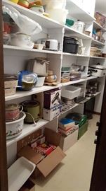 Pantry with toaster, baking and pyrex dishes, large roaster, tupperware.