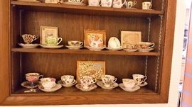 Tea cups and saucers from Japan, Germany, etc.  Small framed prints for the home.