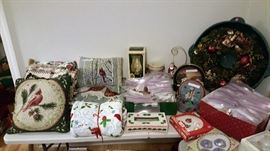 Christmas room loaded with blankets to get cozy with, wreaths to hang and ornaments to decorate the tree with!