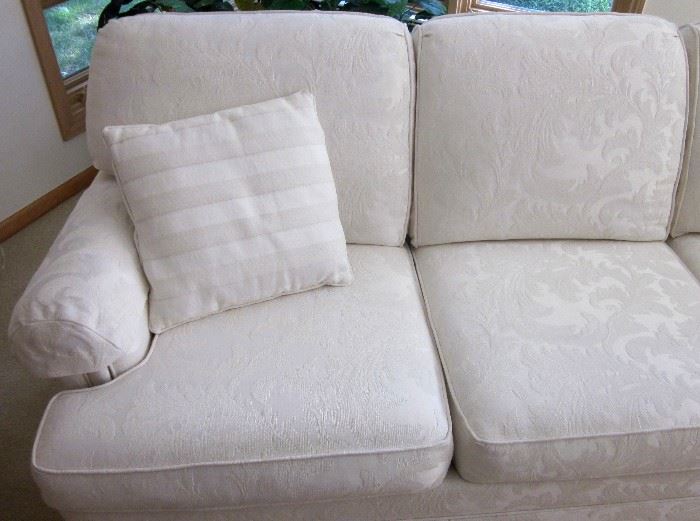 Thomasville 3-cushion sofa, attached pillow back, rolled arms, off-white damask style fabric.  79" long