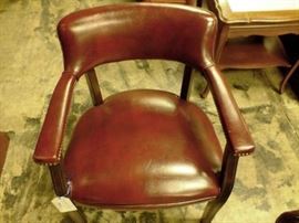 Oxblood guest chairs with padded back, arms and nail head trim. We have 10 of these.