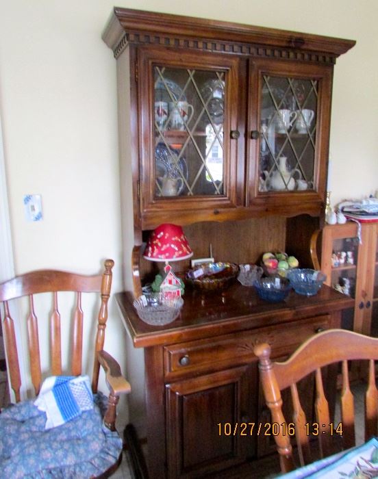 Dark pine kitchen hutch, oval table and 4 chairs