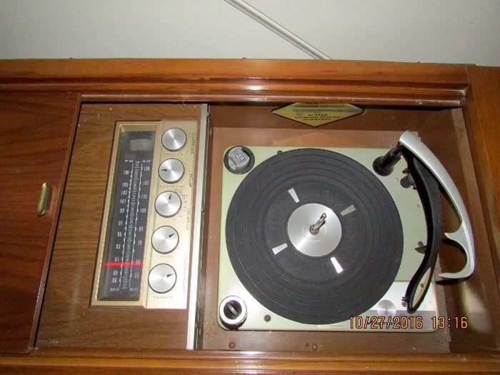 Magnavox console turntable and radio - plus we have records to play on it.