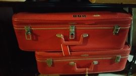 set of 3 red suitcases, only 2 pictured