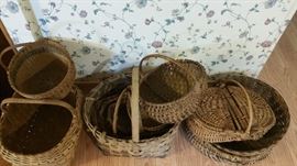Collection of primitive baskets, hand made. Including a butt basket.