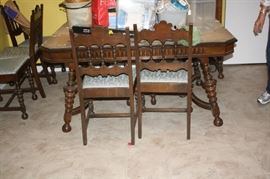 Antique 1920's dining room table and 6 chairs.  Legs on table are gorgeous.