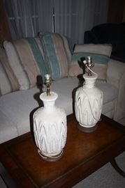 Gorgeous Mid Century modern lamps.  Insides light up.  One has orange bulb and one has red bulb.  Very uniques 