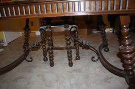Antique dining room table legs.  Note the curved wood and the iron.  gorgeous