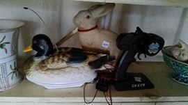 remote duck decoy, concrete rabbit with glass eyes