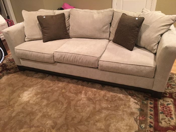 Macy's couch in excellent condition with exposed wood leg.