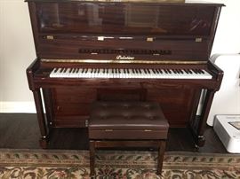 Palatino brown lacquered piano and bench in excellent condition.