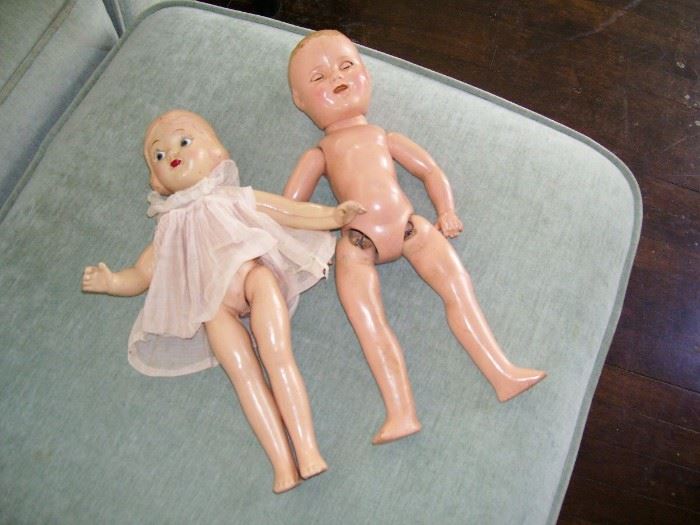 2 vintage composition dolls.  One is wearing a (labeled) Shirley Temple dress.