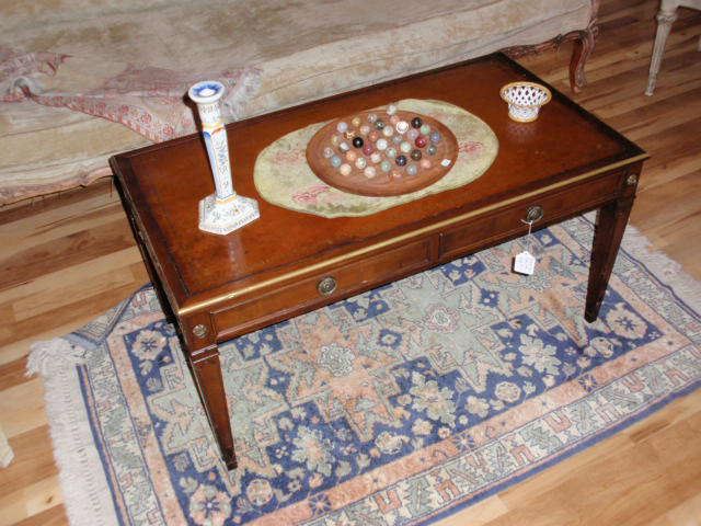 Mahogany Leather Top Coffee table w/ 2 drawers and side pullouts.