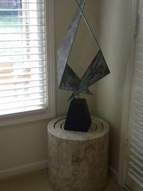 Abstract metal art on stand