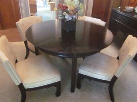 Black Lacquer table, has 3 leaves and 6 chairs. Pictured at its smallest with 4 chairs. Matching Buffet