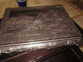 black lacquer w/ mother of pearl in lay square pedestal.