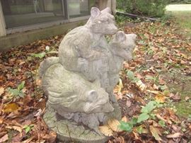 Yard art, cement raccoons
