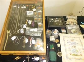 There is some silver jewelry but no gold. Swarovski Crystal miniature figurines.