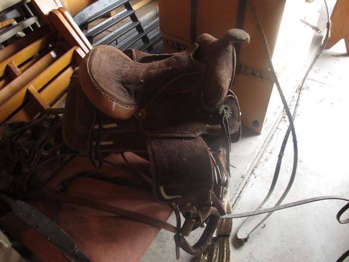 ONE OF THE MANY VINTAGE AND ANTIQUE SADDLES. THIS WAS FROM KID ROCKs PONY!