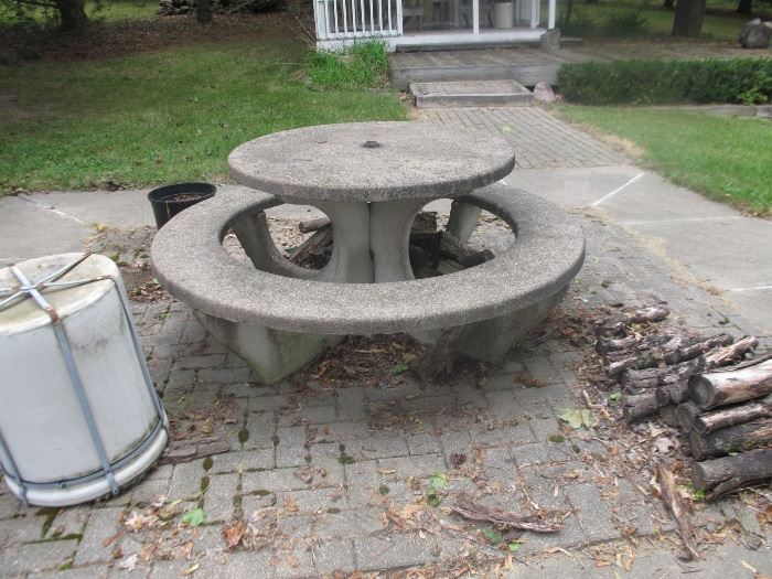 SOLID CEMENT TABLE BUT, WAIT  IT TOTALLY COMES APART. WE HAVE 2 OF THEM