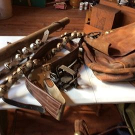 YES, AUTHENTIC SHEIGH BELLS AND TONS OF TAC ITEMS. Yes you see real leather saddle bags!