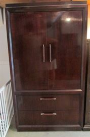 Hendredon - perfect for den or bedroom.  Top has 2-3 heavy duty shelves for clothing, books, office supplies, etc