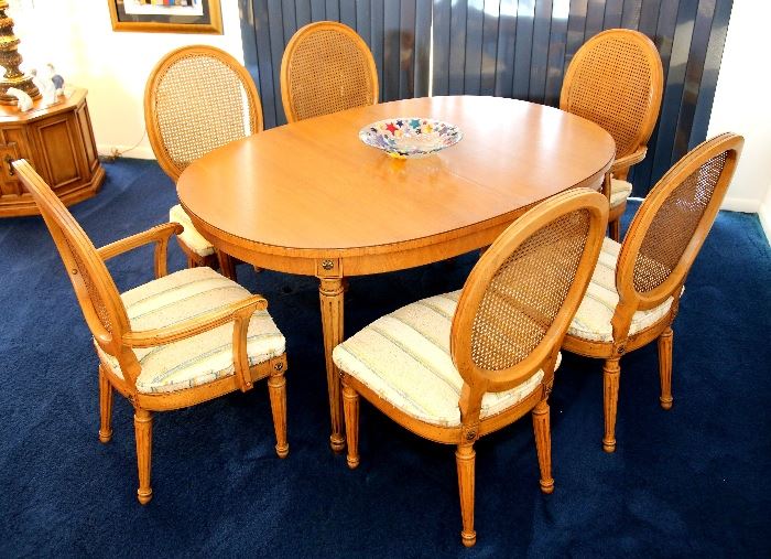 Thomasville dining room table and six chairs. Table has two leaves, pads and a glass top which can be placed on the table.  Dimensions without the two leaves: 58" L x 40" W.