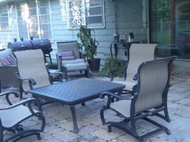 Patio furniture galore, coffee table, rocking chairs, chairs, ottomans, loveseat and more