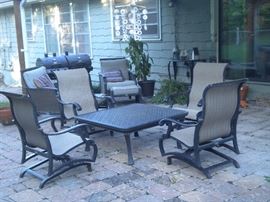 Patio furniture galore, coffee table, rocking chairs, chairs, ottomans, loveseat and more