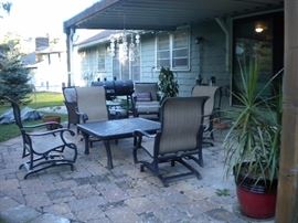 Patio furniture galore, coffee table, rocking chairs, chairs, ottomans, loveseat and more