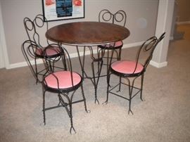 Ice cream parlor table and chairs with pink accent seating!