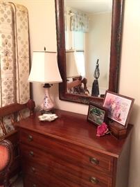 Four-drawer chest, mirror, and vintage lamp