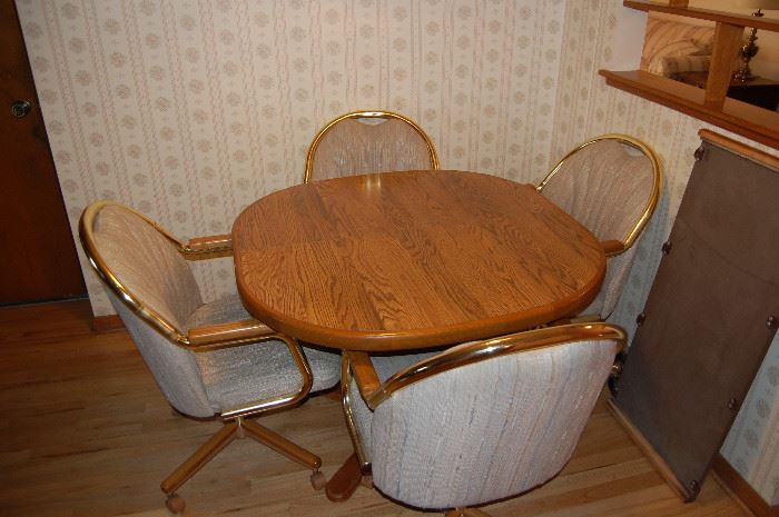 Classic kitchen table with rolling captains chairs