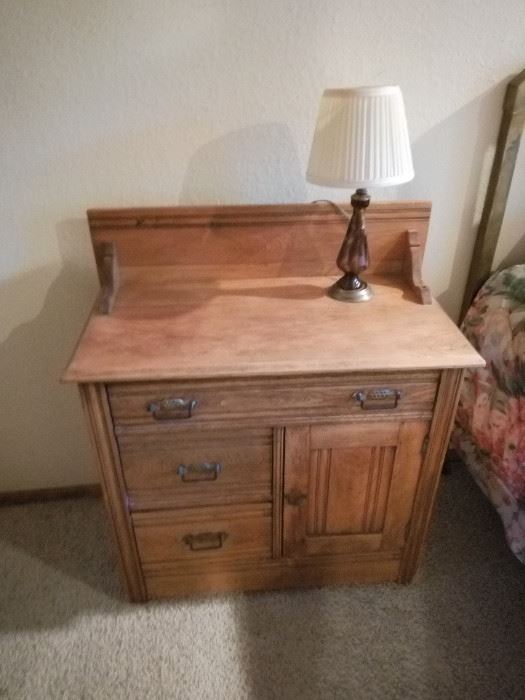 Commode used here as a bed side table