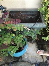 One of two wrought iron planters for sale 