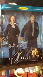 Over 50 boxed Barbie's!! The X Files, "totally Hair", Hallmark, Avon, Collegiate plus accessories