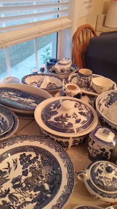 Table full of assorted Blue Willow accessories and place settings