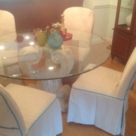 Ballard dining table. 8 parsons chairs with custom slip covers. 