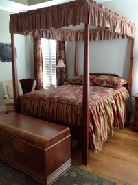 Bedroom suite is solid wood hand crafted in excellent condition. Includes bed, two nightstands, highboy, dresser and full length mirror on a stand. One of a kind